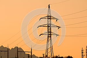 High voltage electrical pole sunset silhouette