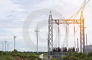 high voltage electrical power pylon substation with wind turbines renewable wind energy