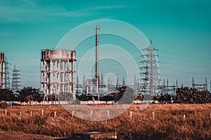 High voltage Electrical substation with steel frames, insulators and electricity transmission power lines and blue sky background