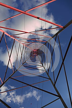 High Voltage Electricity Grid Pylon seen from below with sky photo