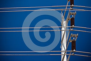 High voltage electricity pole in blue sky