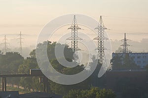 High voltage electricity poles on a foggy summer morning, Daugavpils, Latvia