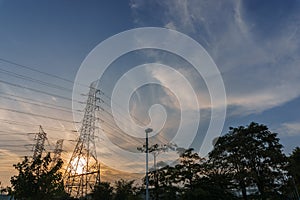 high voltage electricity post with sunset background