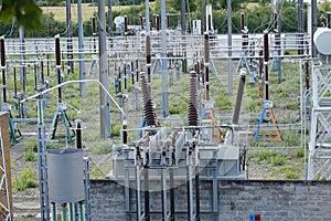 High voltage electricity power distribution plant and electricity pillars with ceramic insulator and a lot of cables