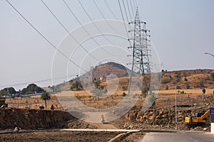 High Voltage Electricity Power Transmission Lines and Hill in India