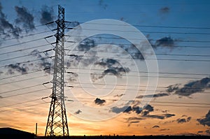 High voltage electricity pylon on sunset