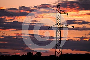 High voltage electricity pylon on the sunset.