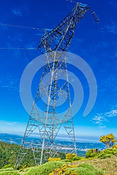 High voltage electricity tower blue sky clear background