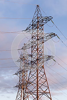 A high-voltage electricity tower. A High-voltage power transmission tower. Power engineering.