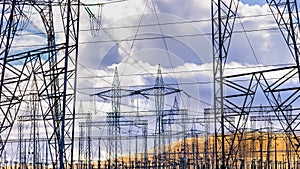 High voltage electricity towers and power lines at a substation in Central California; a substation is a part of an electrical