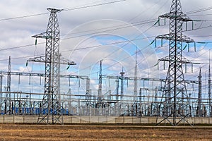 High-voltage electricity transmission pylon power lines and towers. Industrial electricity distribution