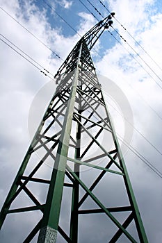 High voltage eletrical towers and lines with blue sky and clouds. Eletricity towers with blue sky background. Transmission tower.