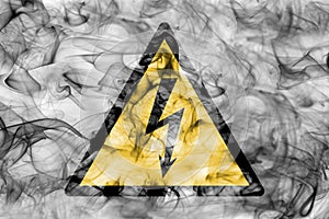 High Voltage hazard warning smoke sign. Triangular warning hazard sign, smoke background.