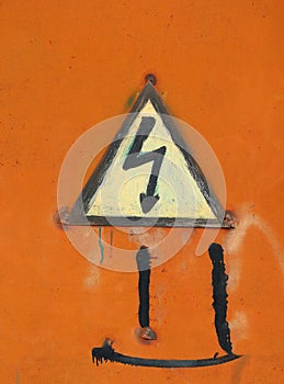High voltage lightning sign in yellow triangle on rusty metal door, grunge abstract background