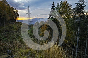 High-voltage line in the autumn mountains