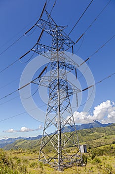 High voltage lines beneath the blue cloudy sky photo