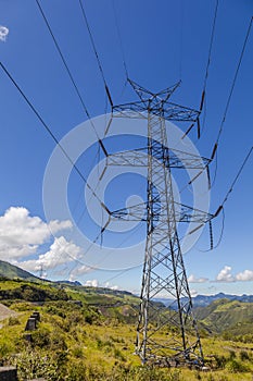 High voltage lines beneath the blue cloudy sky photo