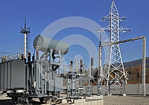 High voltage oil-filled power transformer on electrical substation.