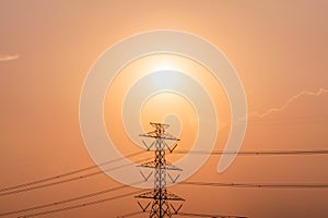 High voltage pole, Transmission tower with power line at sunset
