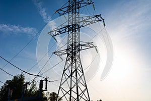 High-voltage pole wires power lines at sunset electricity distribution station.high voltage electric transmission tower