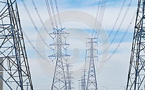 High voltage poles. Power lines on utility tower and cable wires in energy electric technology, network, and industry concept.