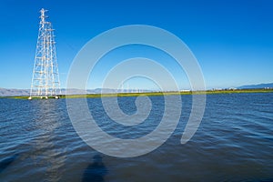 High voltage post,High voltage tower at blue nice sky and sea - Palo Alto, California , USA