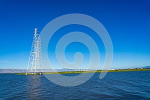 High voltage post,High voltage tower at blue nice sky and sea - Palo Alto, California , USA