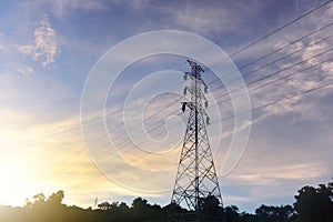 high voltage post.High-voltage tower sky background in countryside at sunset. The sun rise