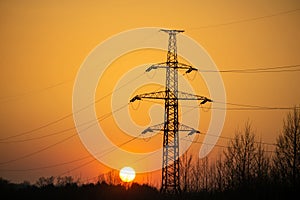 high voltage post.High-voltage tower sky background at sunset
