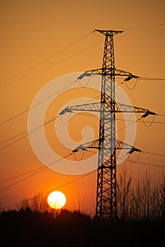 high voltage post.High-voltage tower sky background at sunset