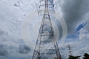 High voltage post.High-voltage tower sky background.Electric pole and electric cable on the field in the countryside