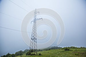 High voltage power, electric pose and electric cords stand alone with sky background