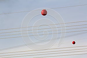 High voltage power line with big ball for warning pilots, low fl