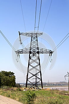 The high-voltage power line on blue sky background