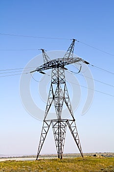 The high-voltage power line on blue sky background