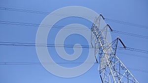 High voltage Power line tower in blue sky background landscape, electricity concept