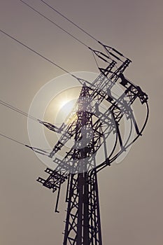 High-voltage power line tower carry green electricity sun energy