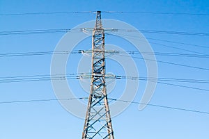 High-voltage power line tower on sky background at autumn in Finland