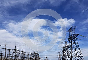 High-voltage power lines at storm clouds.