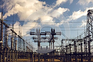 High-voltage  power lines at storm clouds