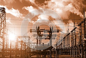 High-voltage  power lines at storm clouds