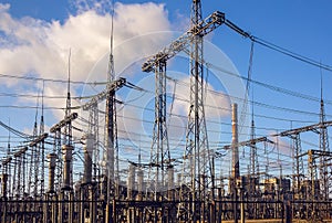 High-voltage  power lines at storm clouds