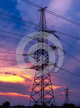 High-voltage  power lines at sunset