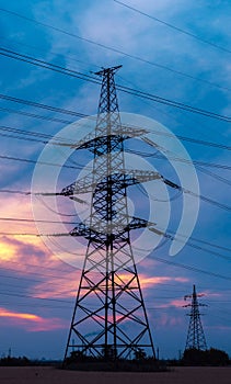 High-voltage  power lines at sunset