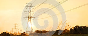 high-voltage power lines at sunset,high voltage electric transmission tower.Electricity distribution station