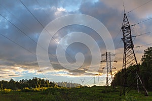 High-voltage power lines at sunset. electricity distribution sta