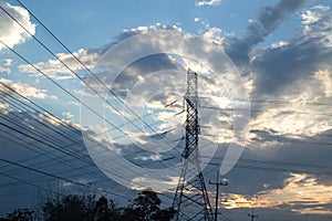 High-voltage power lines at sunset. electricity distribution station