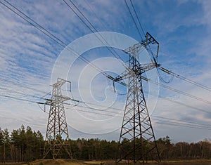 High-voltage power lines at sunset. electricity distribution station. high voltage electric transmission tower.