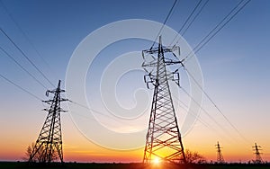 High-voltage power lines at sunset. electricity distribution station. high voltage electric transmission tower