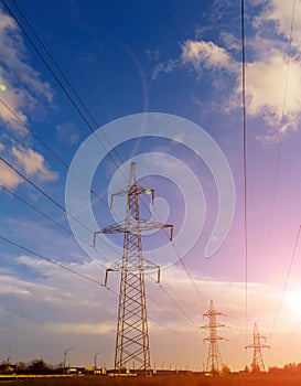 High-voltage power lines at sunset. electricity distribution station. high voltage electric transmission tower